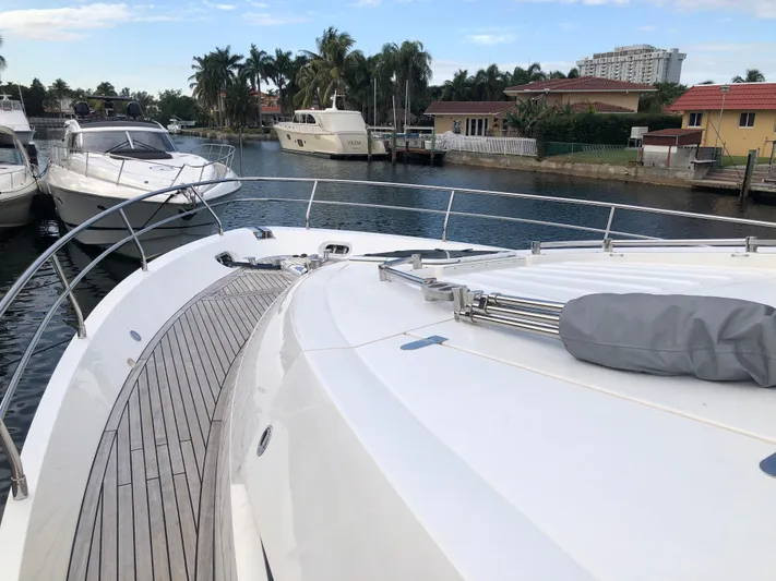  Yacht Photos Pics 2007 Fairline Squadron 68 yacht docked in a scenic marina with palm trees.
