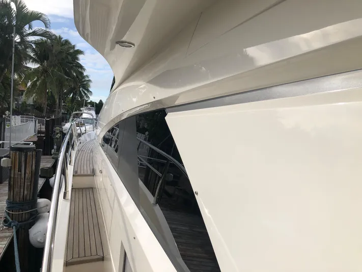  Yacht Photos Pics 2007 Fairline Squadron 68 yacht docked, showcasing sleek design and luxurious deck.