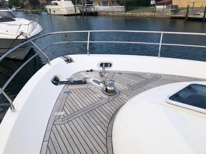  Yacht Photos Pics Bow of 2007 Fairline Squadron 68 yacht with teak decking in marina.