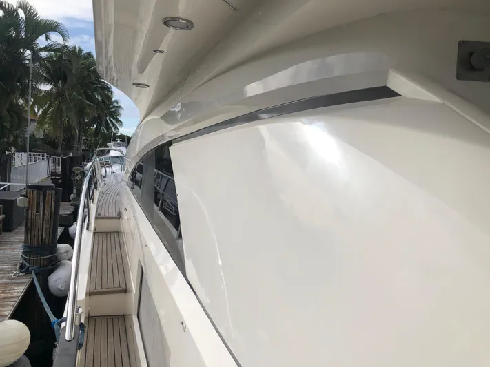  Yacht Photos Pics 2007 Fairline Squadron 68 yacht docked, showcasing sleek design and polished exterior.