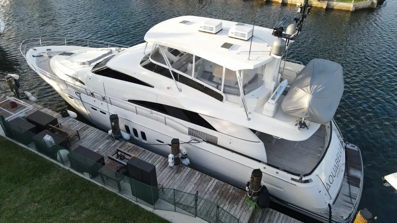  Yacht Photos Pics 2007 Fairline Squadron 68 yacht docked by the water, showcasing sleek design and luxury features.