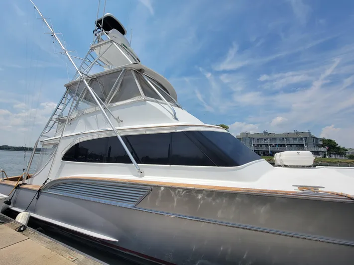  Yacht Photos Pics 1998 Buddy Davis 65 Carolina Custom yacht docked under a clear blue sky.
