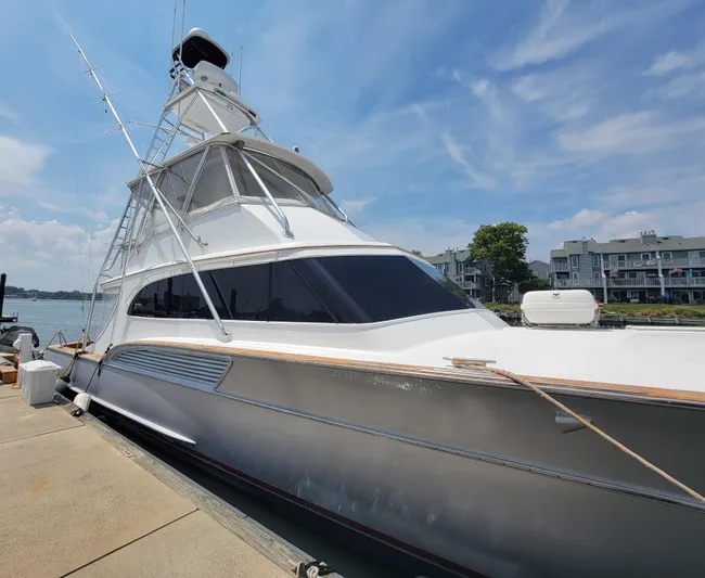  Yacht Photos Pics 1998 Buddy Davis 65 Carolina Custom yacht docked under a clear blue sky.