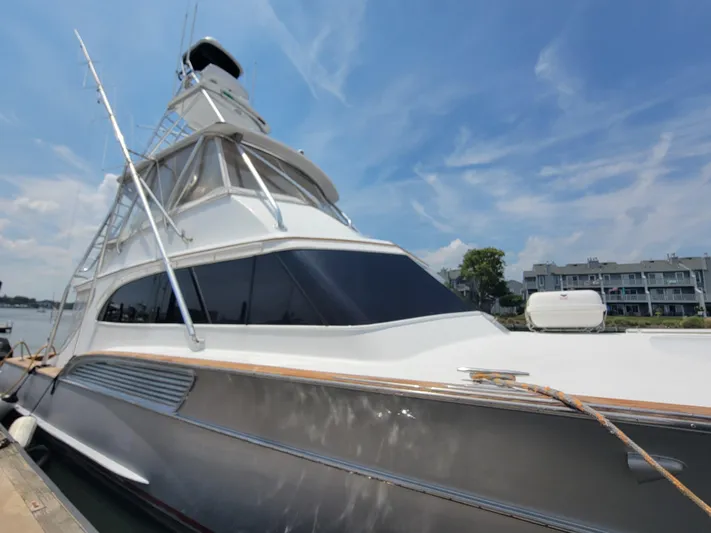  Yacht Photos Pics 1998 Buddy Davis 65 Carolina Custom yacht docked under a clear blue sky.