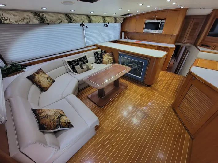  Yacht Photos Pics Luxurious interior of 1998 Buddy Davis 65 Carolina Custom yacht with elegant seating and wood flooring.