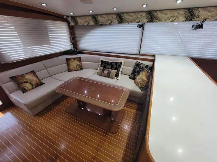  Yacht Photos Pics Luxurious interior of 1998 Buddy Davis 65 Carolina Custom yacht with elegant seating and table.