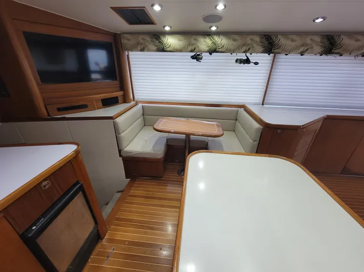  Yacht Photos Pics Interior of 1998 Buddy Davis 65 Carolina Custom yacht with seating and dining area.