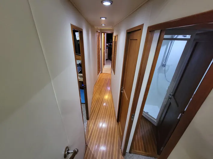  Yacht Photos Pics Interior hallway of 1998 Buddy Davis 65 Carolina Custom yacht with wood flooring and doors.