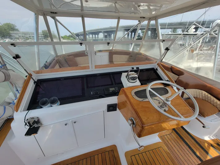  Yacht Photos Pics 1998 Buddy Davis 65 Carolina Custom yacht helm with wooden accents and modern controls.