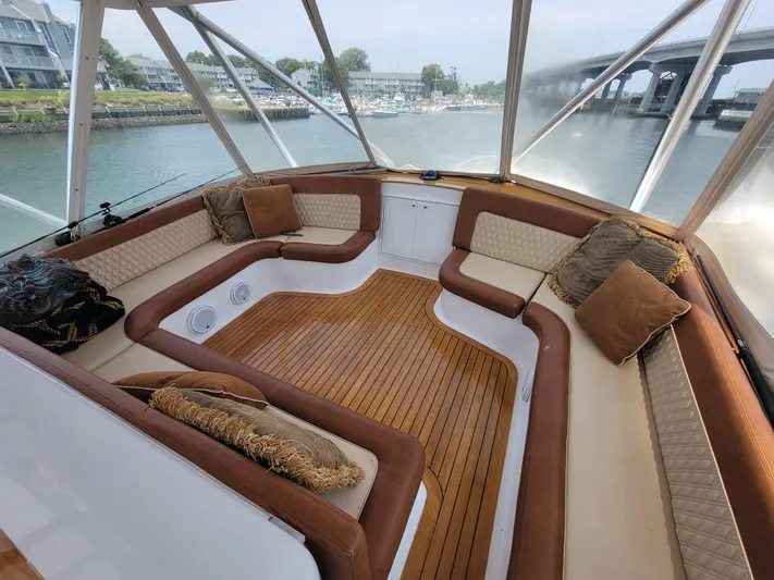 Yacht Photos Pics Luxurious seating area on a 1998 Buddy Davis 65 Carolina Custom yacht with wood flooring.
