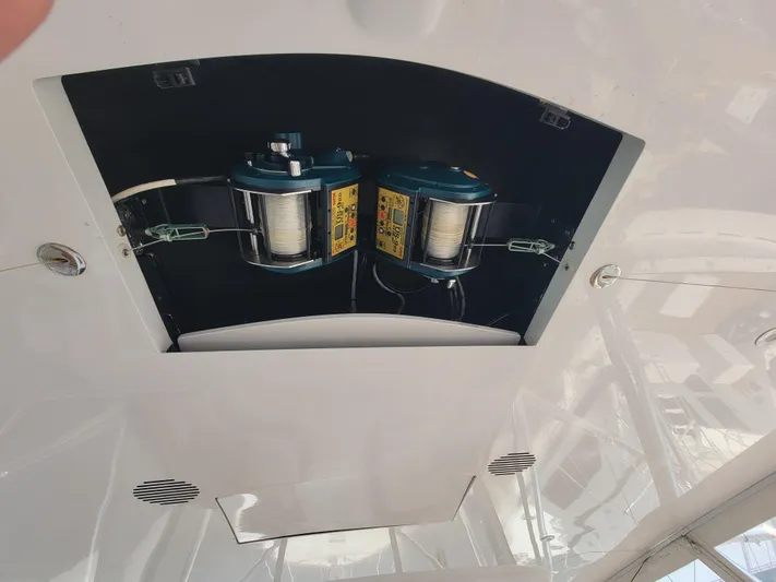  Yacht Photos Pics Fishing reels mounted on 1998 Buddy Davis 65 Carolina Custom boat ceiling.