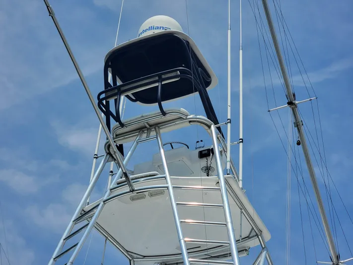  Yacht Photos Pics Tower of 1998 Buddy Davis 65 Carolina Custom yacht against blue sky.