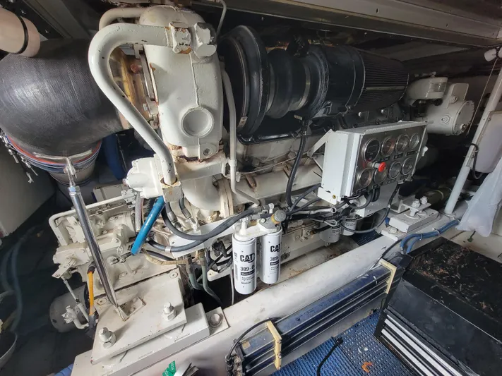  Yacht Photos Pics Engine room of 1998 Buddy Davis 65 Carolina Custom yacht, showcasing detailed machinery.