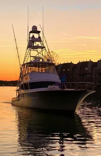  Yacht Photos Pics 1998 Buddy Davis 65 Carolina Custom yacht at sunset on calm waters.