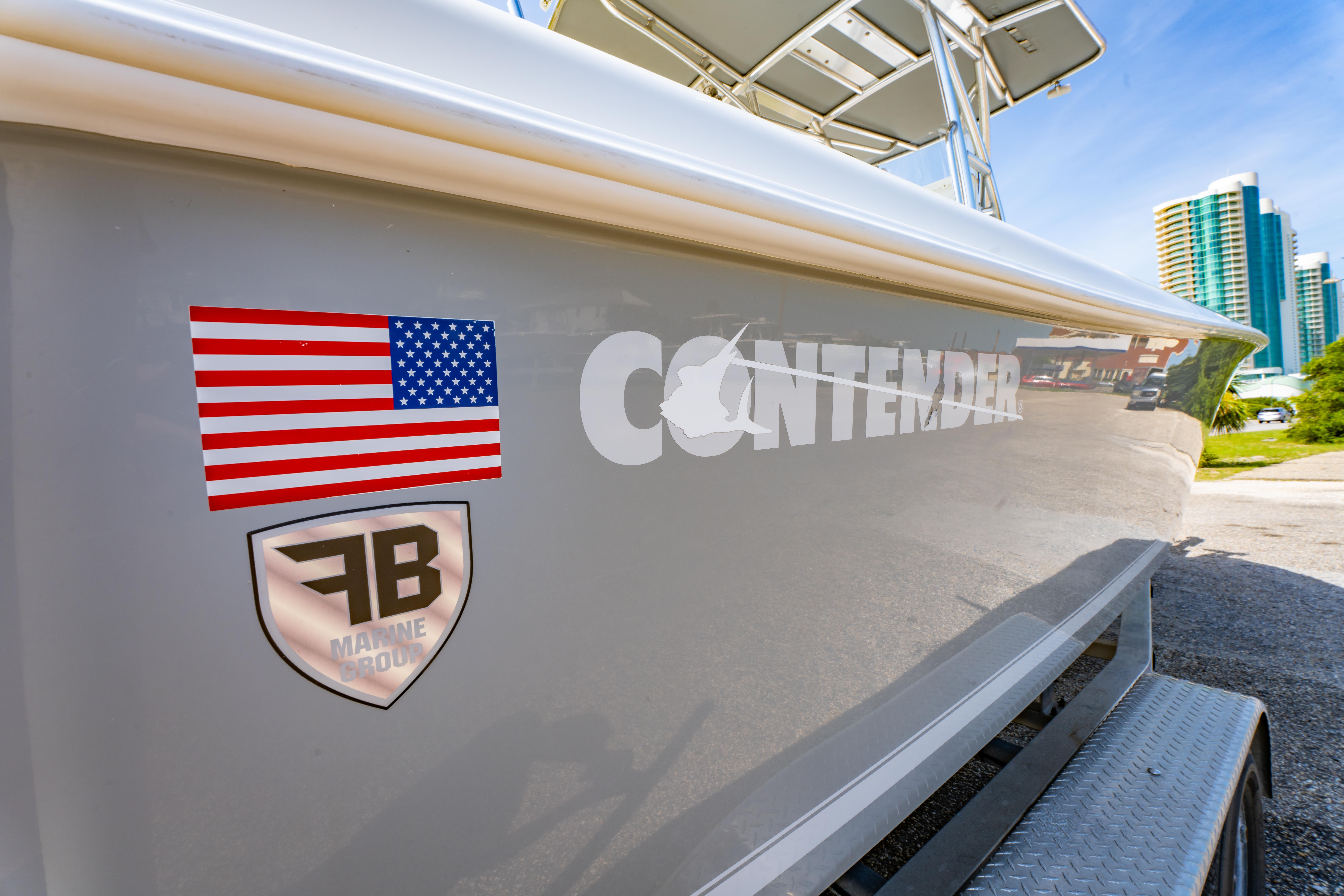 2022 Contender 25T boat with American flag and FB Marine Group logo.