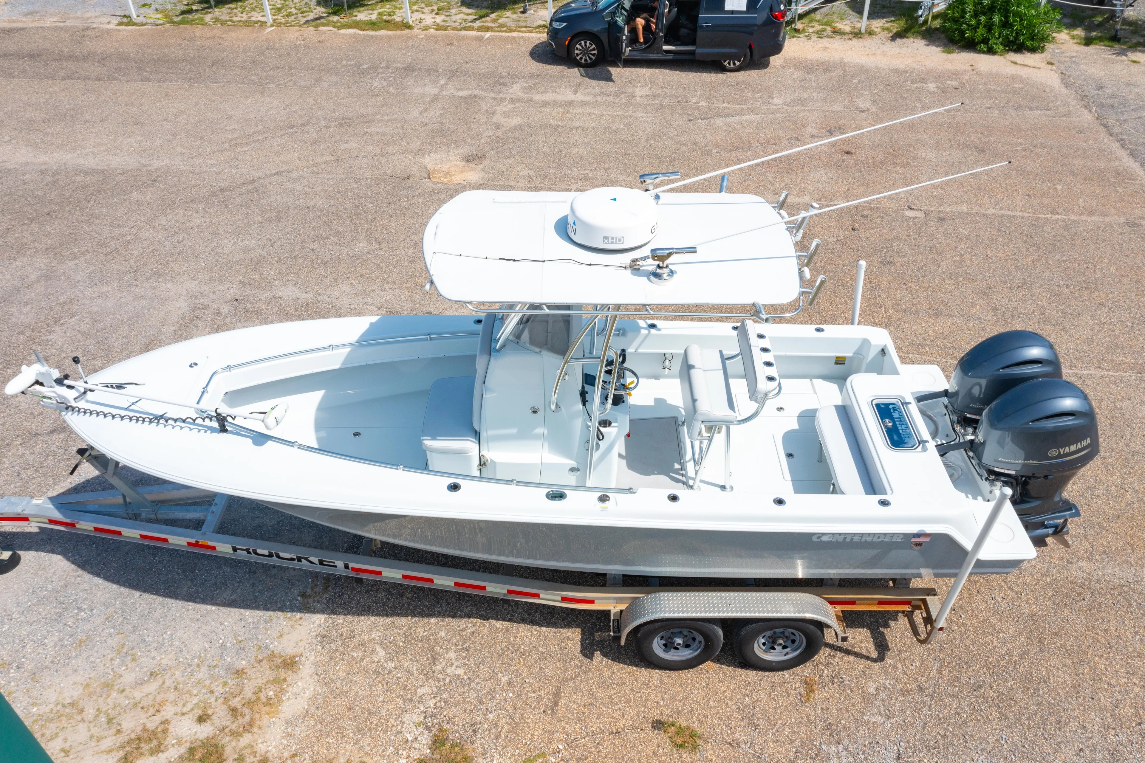 2022 Contender 25T boat on trailer with dual Yamaha engines, aerial view.