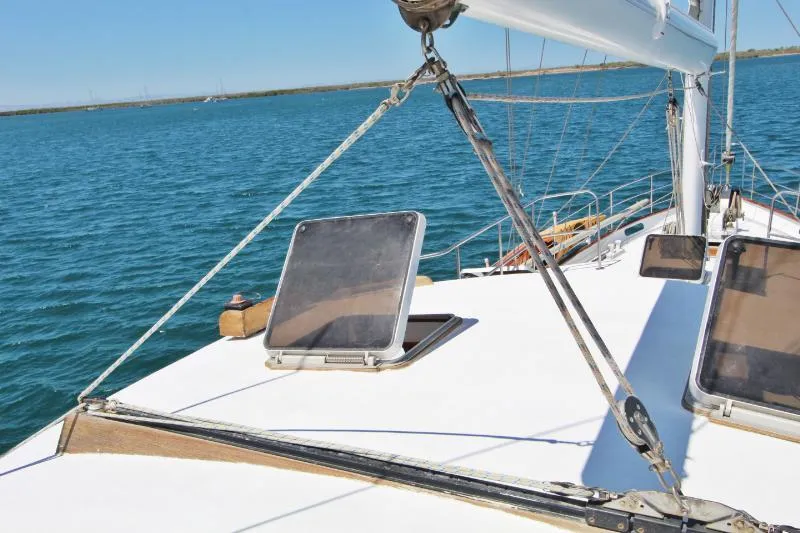  Yacht Photos Pics Centre cockpit pilot house steel cutter motorsailer on calm blue waters, 1991 model, 70 ft.