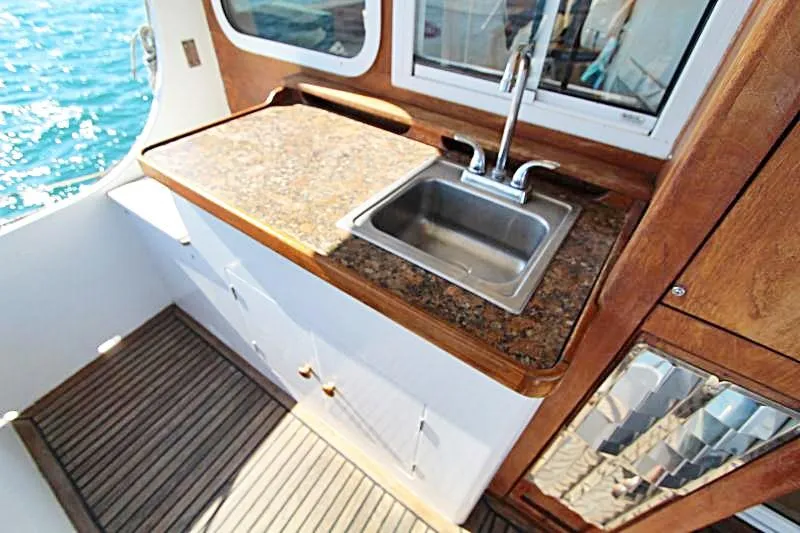  Yacht Photos Pics Centre cockpit pilot house with sink on a 1991 steel cutter motorsailer, 70 ft.