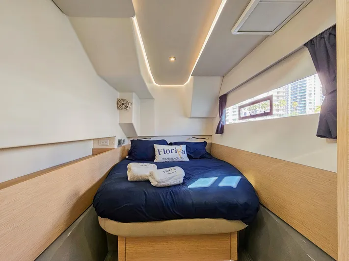 Floripa Yacht Photos Pics Cozy cabin interior of 2017 Fountaine Pajot MY 37 yacht with bed and window view.