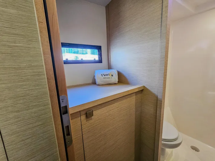 Floripa Yacht Photos Pics Bathroom interior of 2017 Fountaine Pajot MY 37 yacht with window and storage.