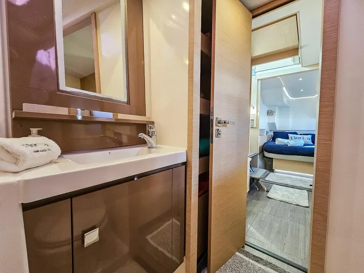 Floripa Yacht Photos Pics Luxurious interior of 2017 Fountaine Pajot MY 37 yacht, featuring a modern bathroom and cozy bedroom.
