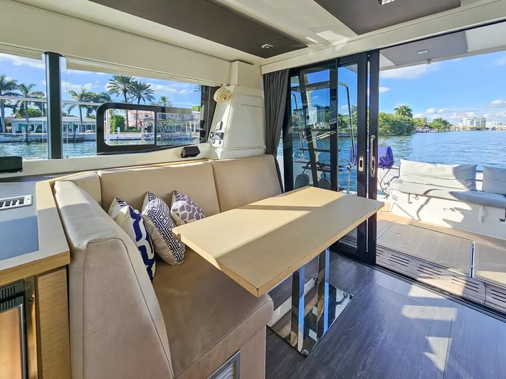 Floripa Yacht Photos Pics Interior of 2017 Fountaine Pajot MY 37 yacht with dining area and scenic water view.