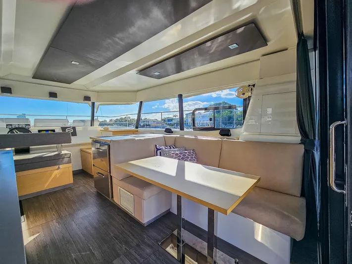 Floripa Yacht Photos Pics Interior of 2017 Fountaine Pajot MY 37 yacht with modern seating and panoramic windows.