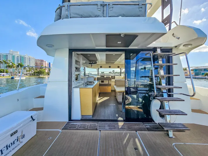 Floripa Yacht Photos Pics Fountaine Pajot MY 37 yacht interior with modern kitchen, docked in scenic waterfront location.