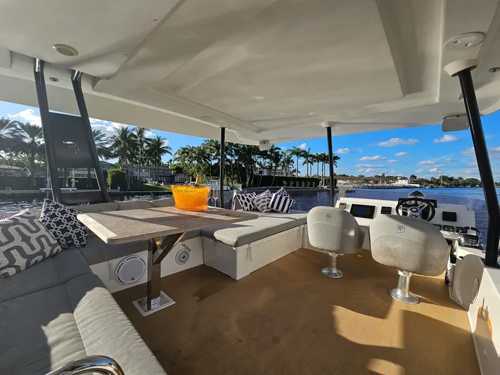 Floripa Yacht Photos Pics Luxurious 2017 Fountaine Pajot MY 37 yacht interior with seating, table, and scenic water view.
