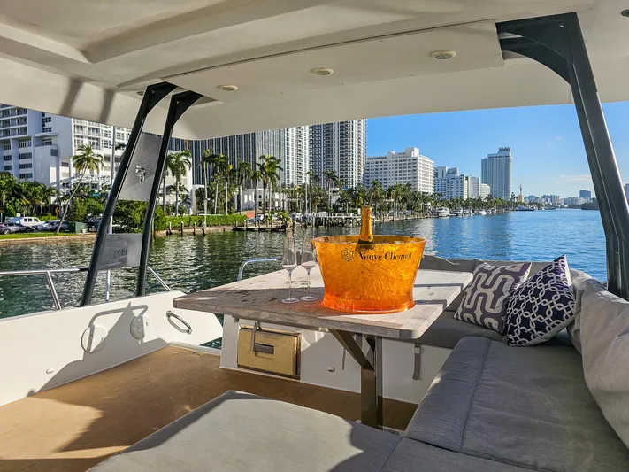Floripa Yacht Photos Pics Luxurious 2017 Fountaine Pajot MY 37 yacht with champagne, city skyline, and waterfront view.