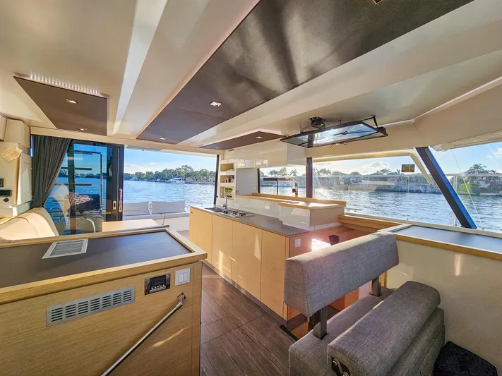 Floripa Yacht Photos Pics Luxurious interior of 2017 Fountaine Pajot MY 37 yacht with scenic water view.