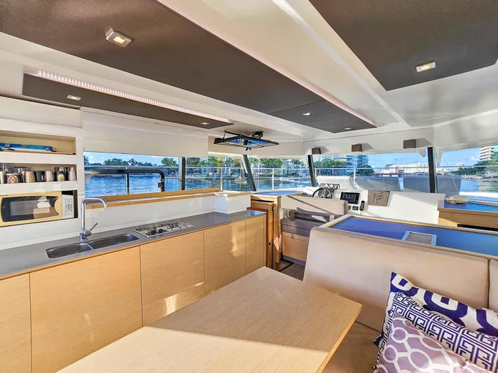 Floripa Yacht Photos Pics Luxurious interior of 2017 Fountaine Pajot MY 37 yacht with modern kitchen and seating area.