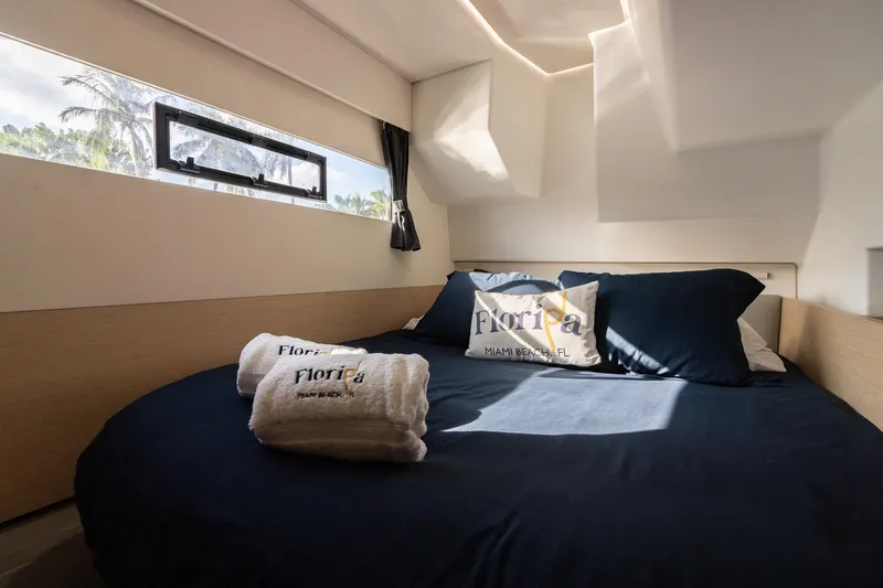 Floripa Yacht Photos Pics Cozy bedroom in 2017 Fountaine Pajot MY 37 yacht with window view and Florida-themed decor.