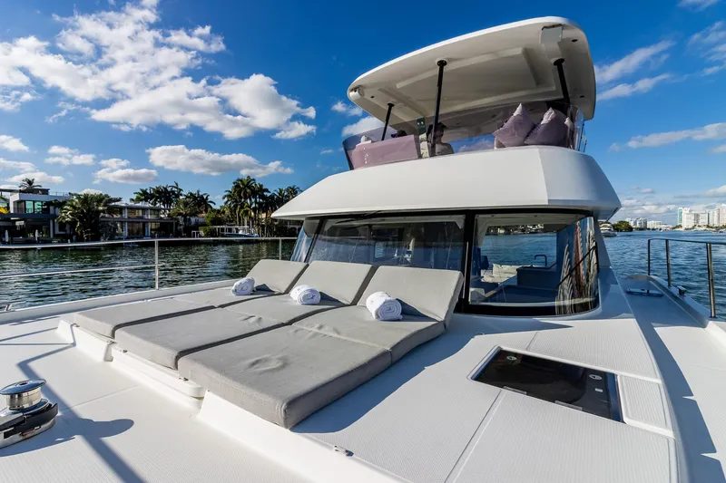 Floripa Yacht Photos Pics 2017 Fountaine Pajot MY 37 yacht with sun loungers on deck, cruising under blue skies.