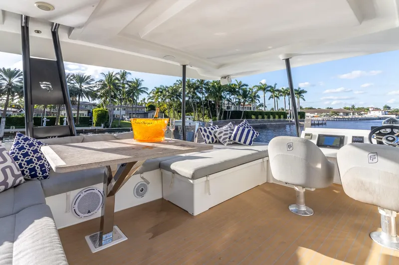 Floripa Yacht Photos Pics Luxurious 2017 Fountaine Pajot MY 37 yacht interior with seating, table, and waterfront view.