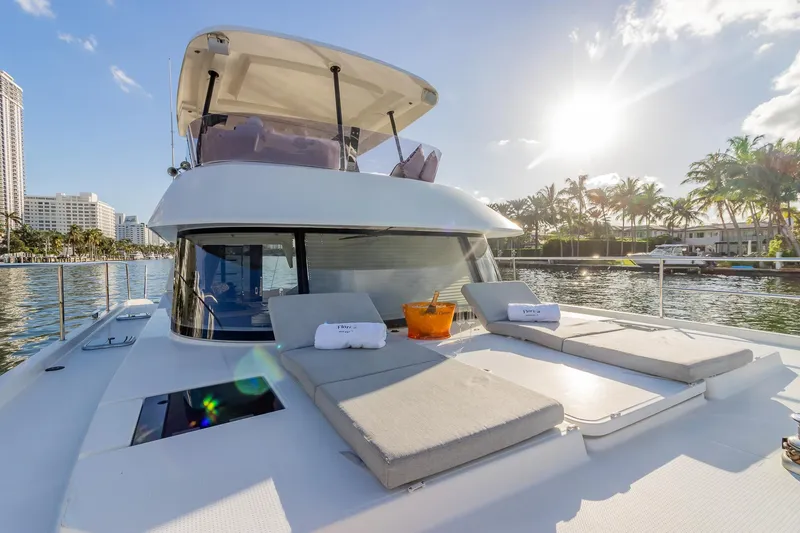Floripa Yacht Photos Pics Luxurious 2017 Fountaine Pajot MY 37 yacht with sun loungers, cruising in sunny waters.