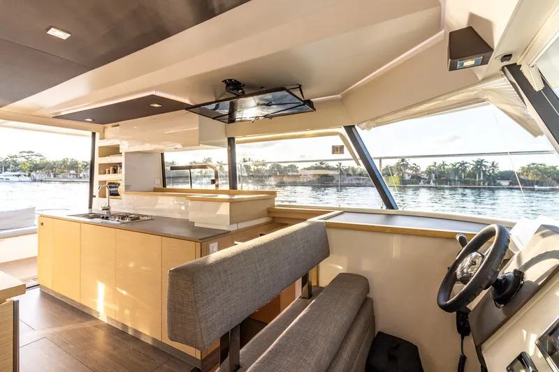 Floripa Yacht Photos Pics Luxurious interior of 2017 Fountaine Pajot MY 37 yacht with modern kitchen and helm.