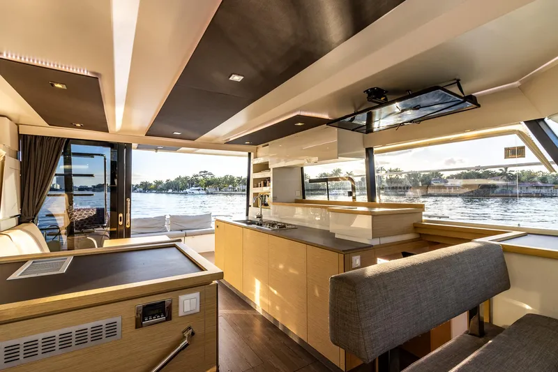 Floripa Yacht Photos Pics Luxurious interior of 2017 Fountaine Pajot MY 37 yacht with modern kitchen and scenic water view.