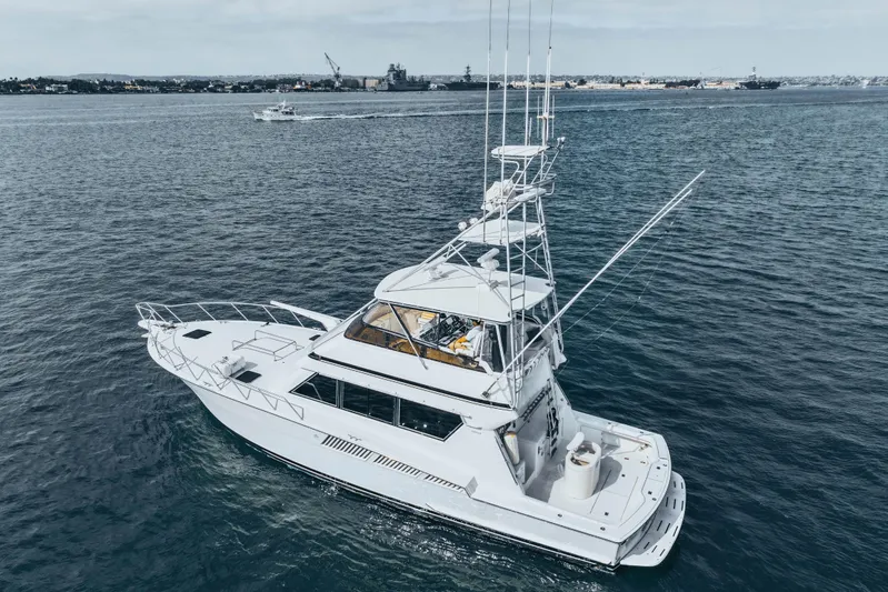 Bloodline Yacht Photos Pics 1990 Hatteras 58 Convertible yacht cruising on open water.