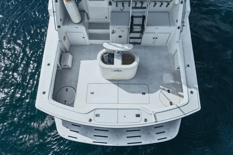 Bloodline Yacht Photos Pics Aerial view of 1990 Hatteras 58 Convertible yacht deck on the water.