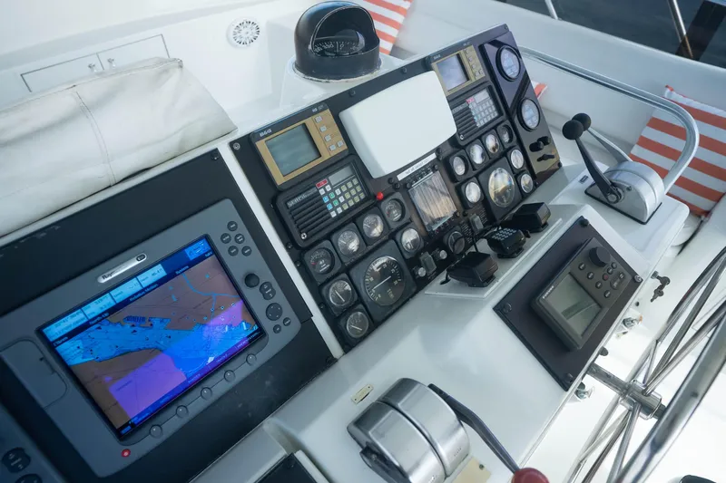Bloodline Yacht Photos Pics Control panel of a 1990 Hatteras 58 Convertible yacht with navigation equipment.