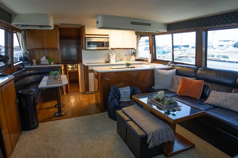 Bloodline Yacht Photos Pics Luxurious interior of a 1990 Hatteras 58 Convertible yacht with modern amenities.