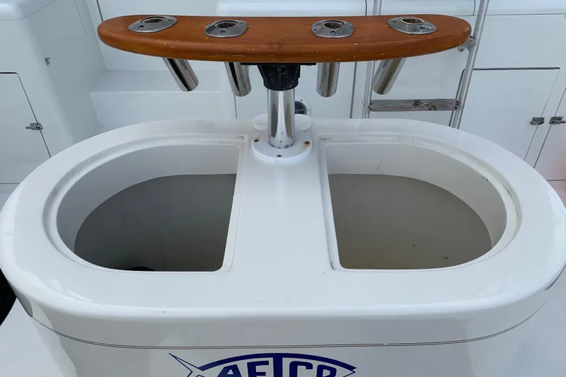 Bloodline Yacht Photos Pics Fishing station on a 1990 Hatteras 58 Convertible yacht with rod holders and bait wells.