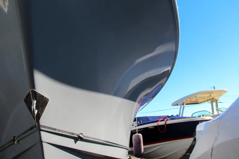  Yacht Photos Pics Close-up of 2021 Sea Hunt Ultra 275 SE boat hulls in a marina.