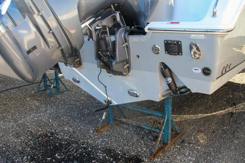  Yacht Photos Pics 2021 Sea Hunt Ultra 275 SE boat on stands, showing the stern and outboard motor.