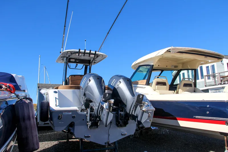  Yacht Photos Pics 2021 Sea Hunt Ultra 275 SE with dual outboard motors in a marina.