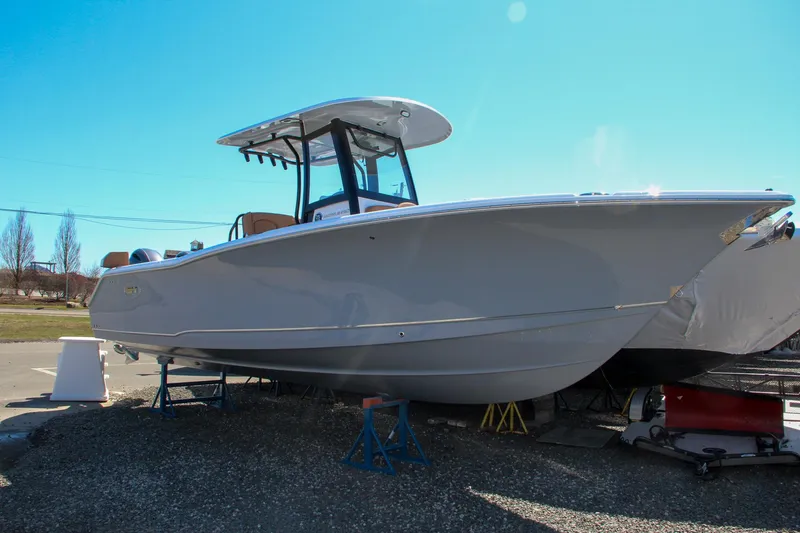  Yacht Photos Pics 2021 Sea Hunt Ultra 275 SE boat on stands in a yard.