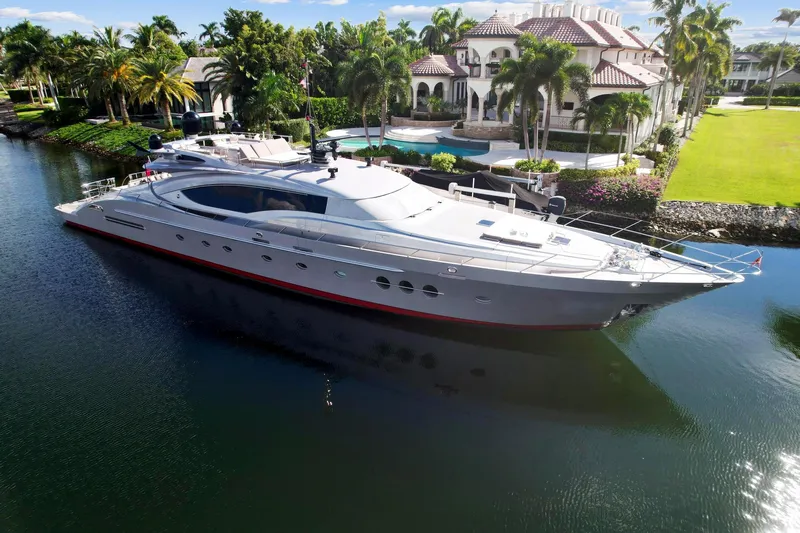 Izumi Yacht Photos Pics 2008 Palmer Johnson 120 Sports Cruiser yacht docked near a luxurious waterfront mansion.