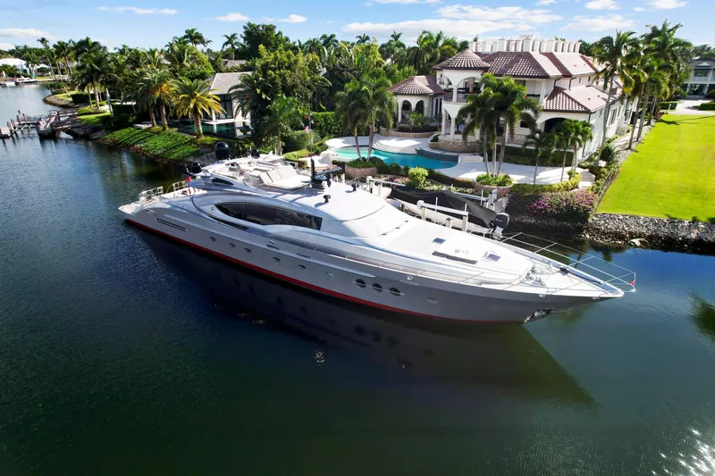 Izumi Yacht Photos Pics Palmer Johnson 120 Sports Cruiser 2008 yacht docked near luxury waterfront mansion.