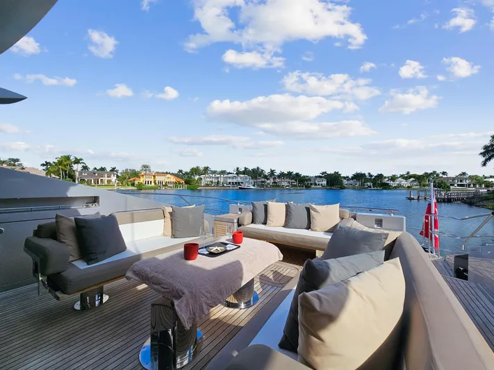 Izumi Yacht Photos Pics Luxurious deck of 2008 Palmer Johnson 120 Sports Cruiser with waterfront view.